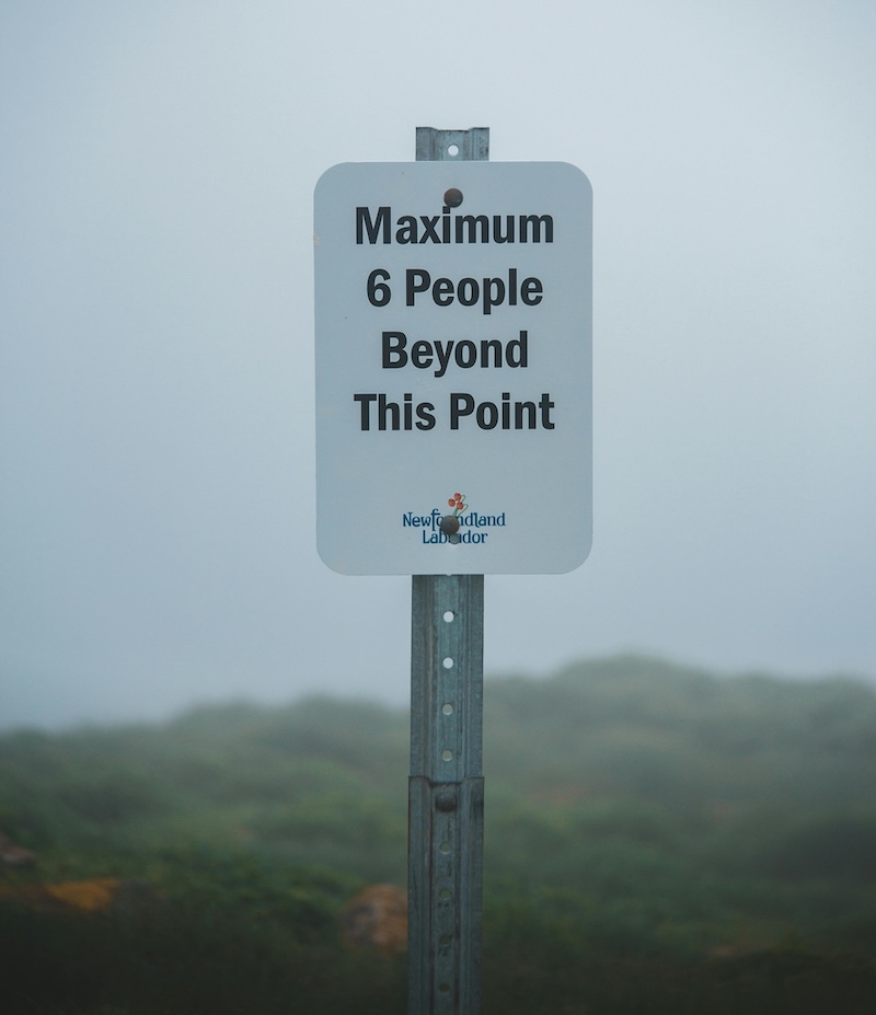 A sign reading 'Maximum 6 people beyond this point'