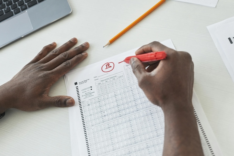 Person Checking Test Papers